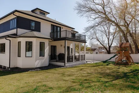 a view of a house with basketball court