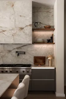 a kitchen with a stove and cabinets