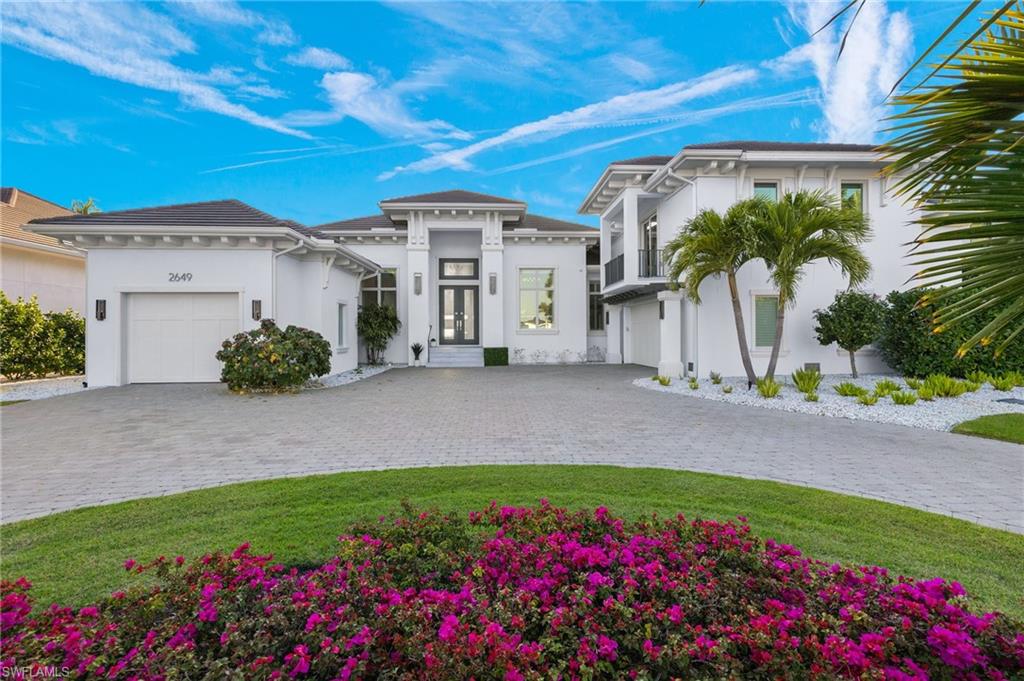 2649 Tarpon Road Naples, FL 34102 - Photo 1 of 50 a front view of house with a yard