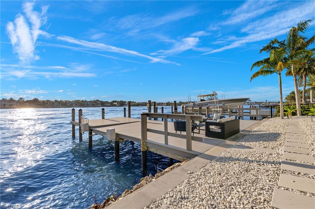 2649 Tarpon Road Naples, FL 34102 - Photo 3 of 50 a view of a terrace with wooden floor and outdoor seating