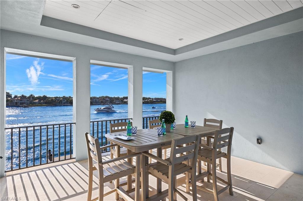 2649 Tarpon Road Naples, FL 34102 - Photo 35 of 50 a view of a dining room with furniture window and outside view