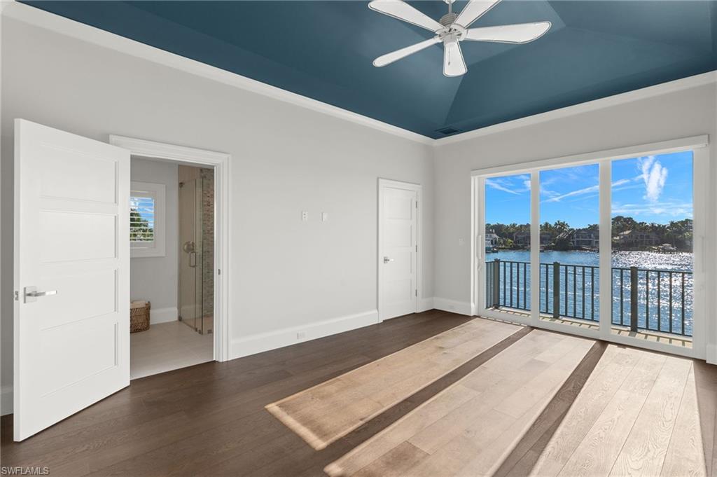 2649 Tarpon Road Naples, FL 34102 - Photo 37 of 50 a view of a big room with wooden floor and windows