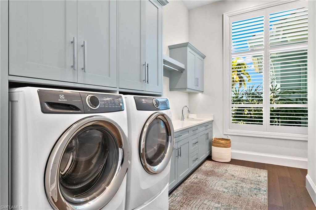2649 Tarpon Road Naples, FL 34102 - Photo 42 of 50 a utility room with dryer and washer