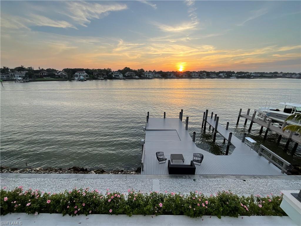 2649 Tarpon Road Naples, FL 34102 - Photo 45 of 50 a view of a lake with houses in the back