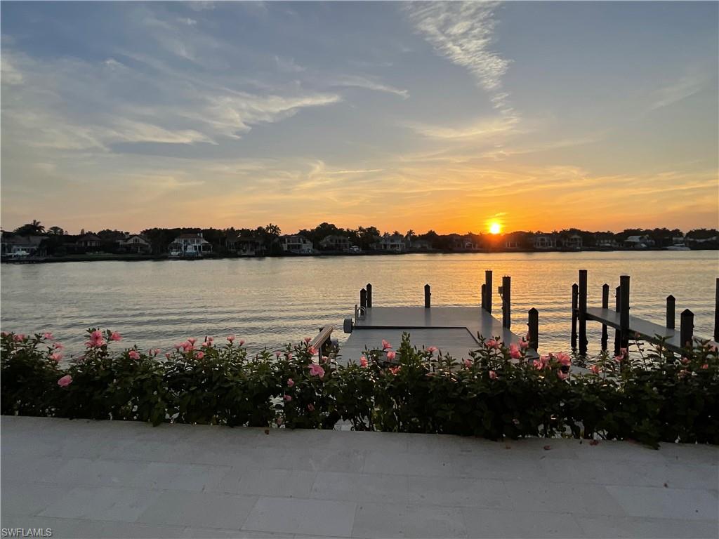 2649 Tarpon Road Naples, FL 34102 - Photo 46 of 50 a view of a lake with houses in background