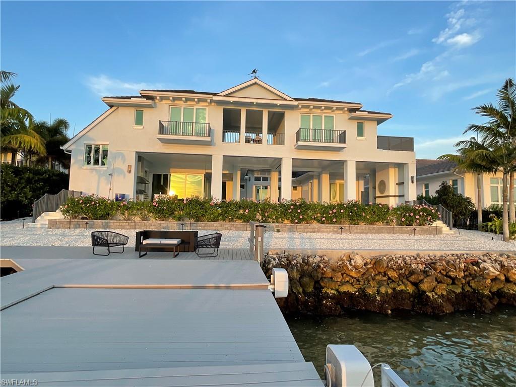 2649 Tarpon Road Naples, FL 34102 - Photo 47 of 50 a front view of a house with swimming pool