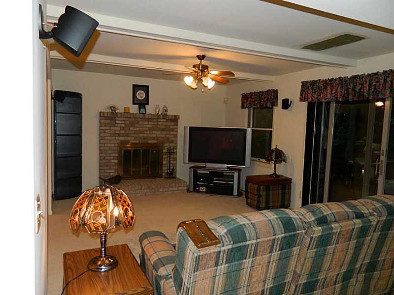 193 Rochester Road Freedom, PA 15042 - Photo 6 of 24 Family Room. Comfortable family room offers a brick log burning fireplace and a slider door that leads to the back deck.