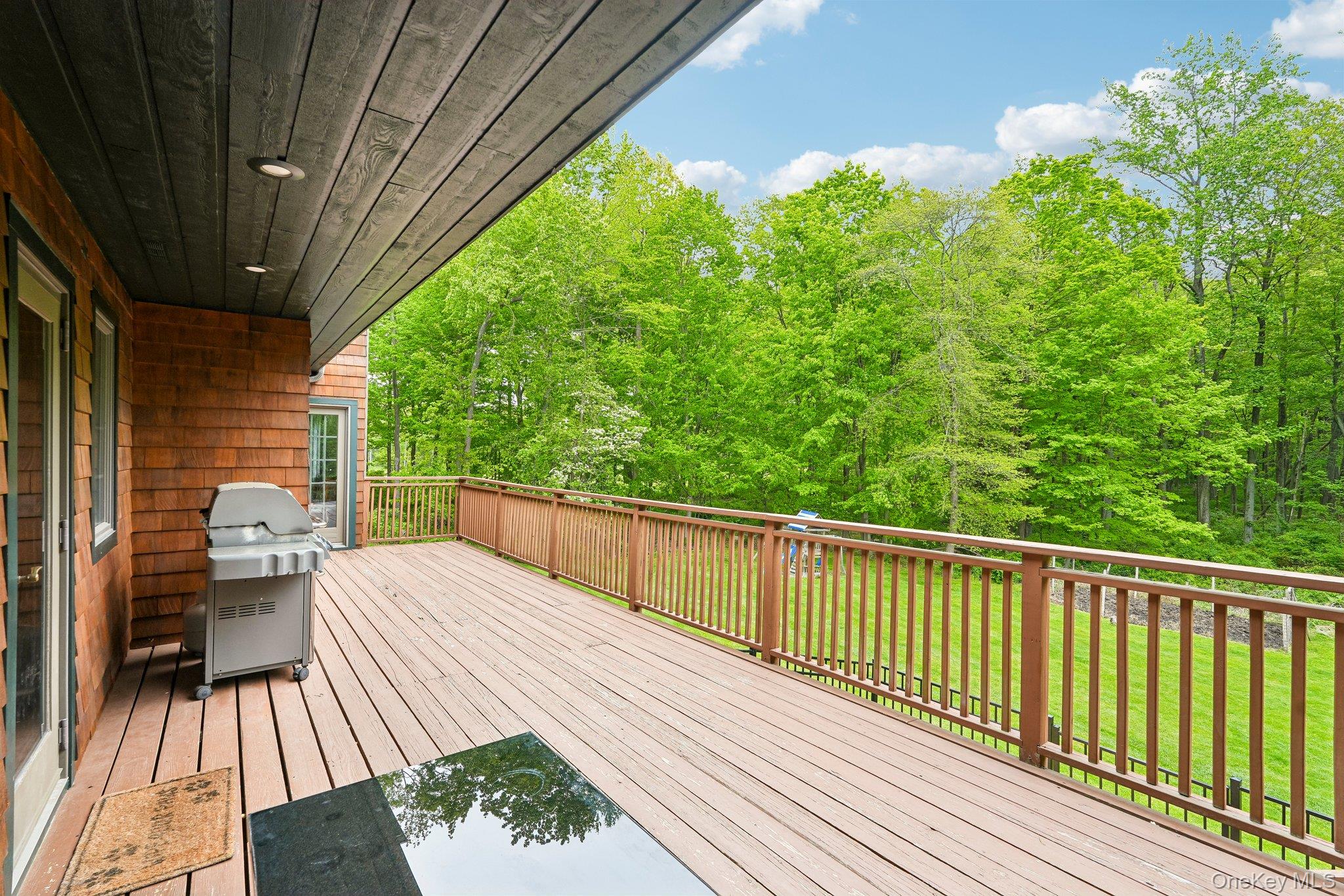 27 Cat Ridge Road North Salem, NY 10560 - Photo 38 of 49 a balcony with wooden floor