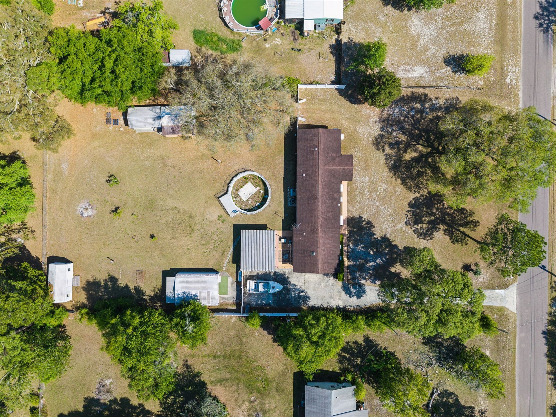 85256 Stephen Road Yulee, FL 32097 - Photo 12 of 48 an aerial view of a house with garden space sitting space and swimming pool