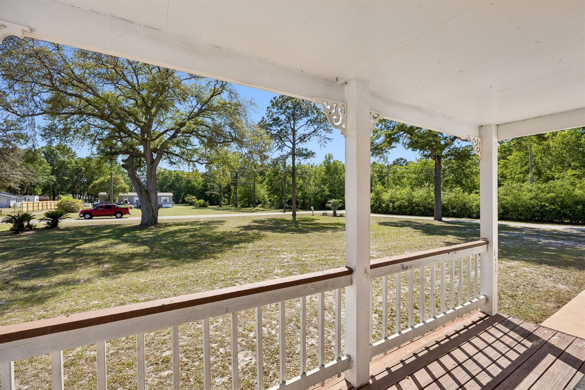 85256 Stephen Road Yulee, FL 32097 - Photo 2 of 48 a view of a porch with a floor to ceiling window next to a yard