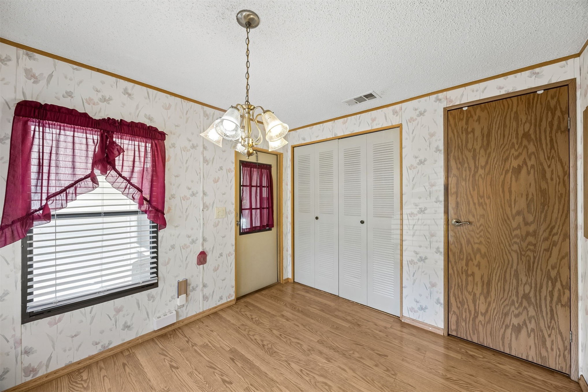 85256 Stephen Road Yulee, FL 32097 - Photo 30 of 48 a view of a room with wooden floor and windows