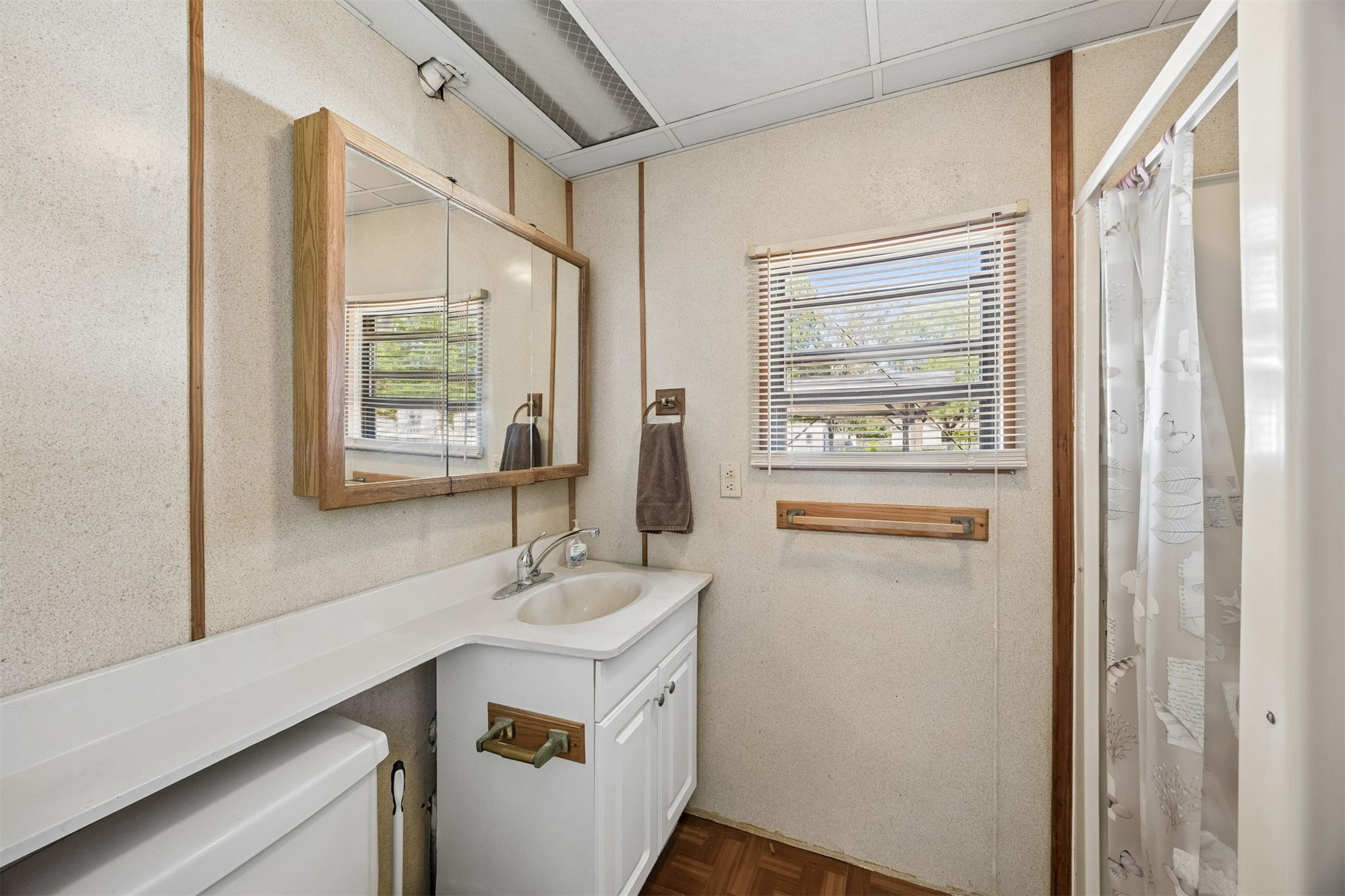 85256 Stephen Road Yulee, FL 32097 - Photo 37 of 48 a bathroom with a sink a mirror and a window