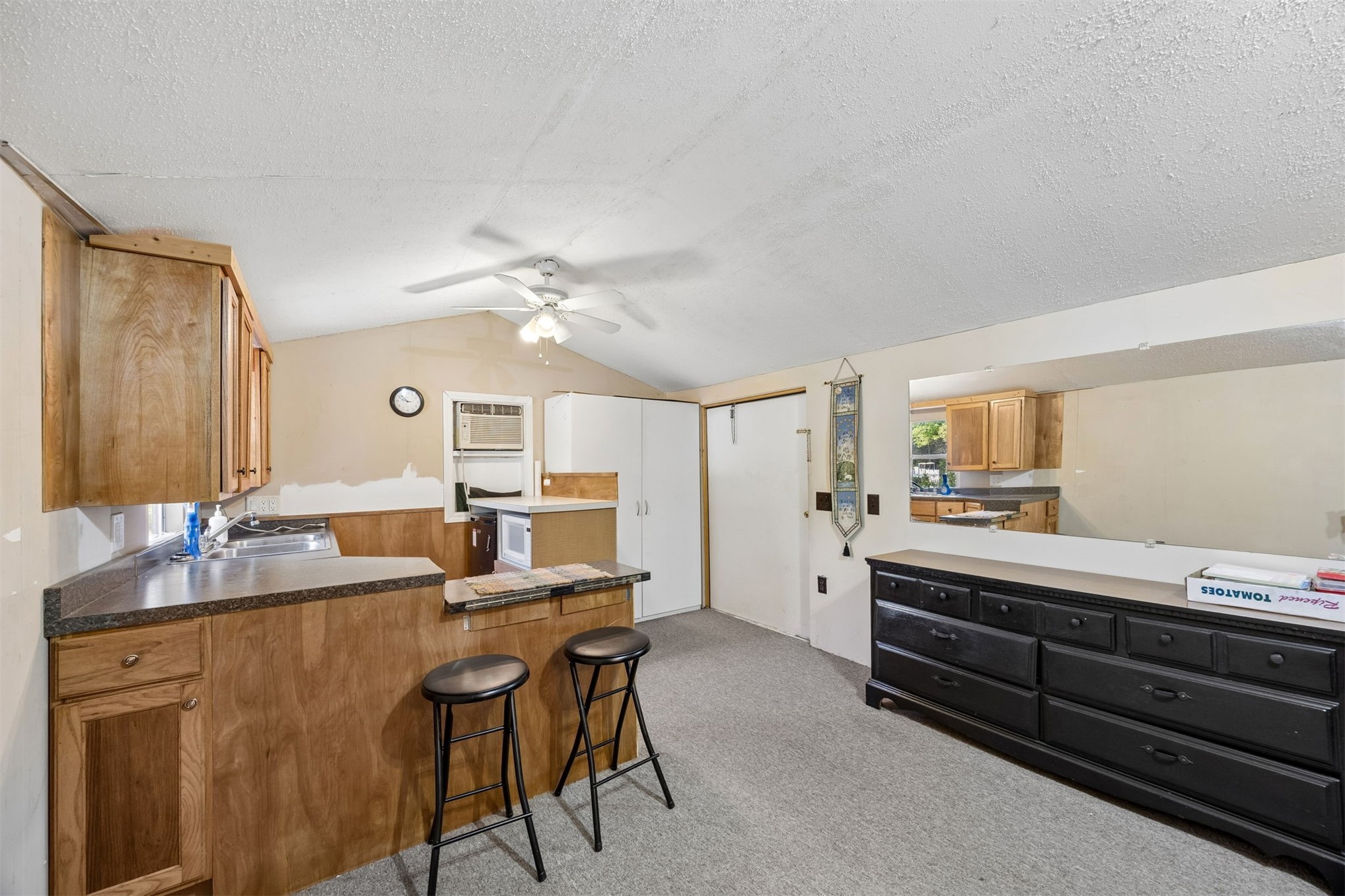 85256 Stephen Road Yulee, FL 32097 - Photo 40 of 48 a room with stainless steel appliances kitchen island granite countertop furniture and a kitchen view