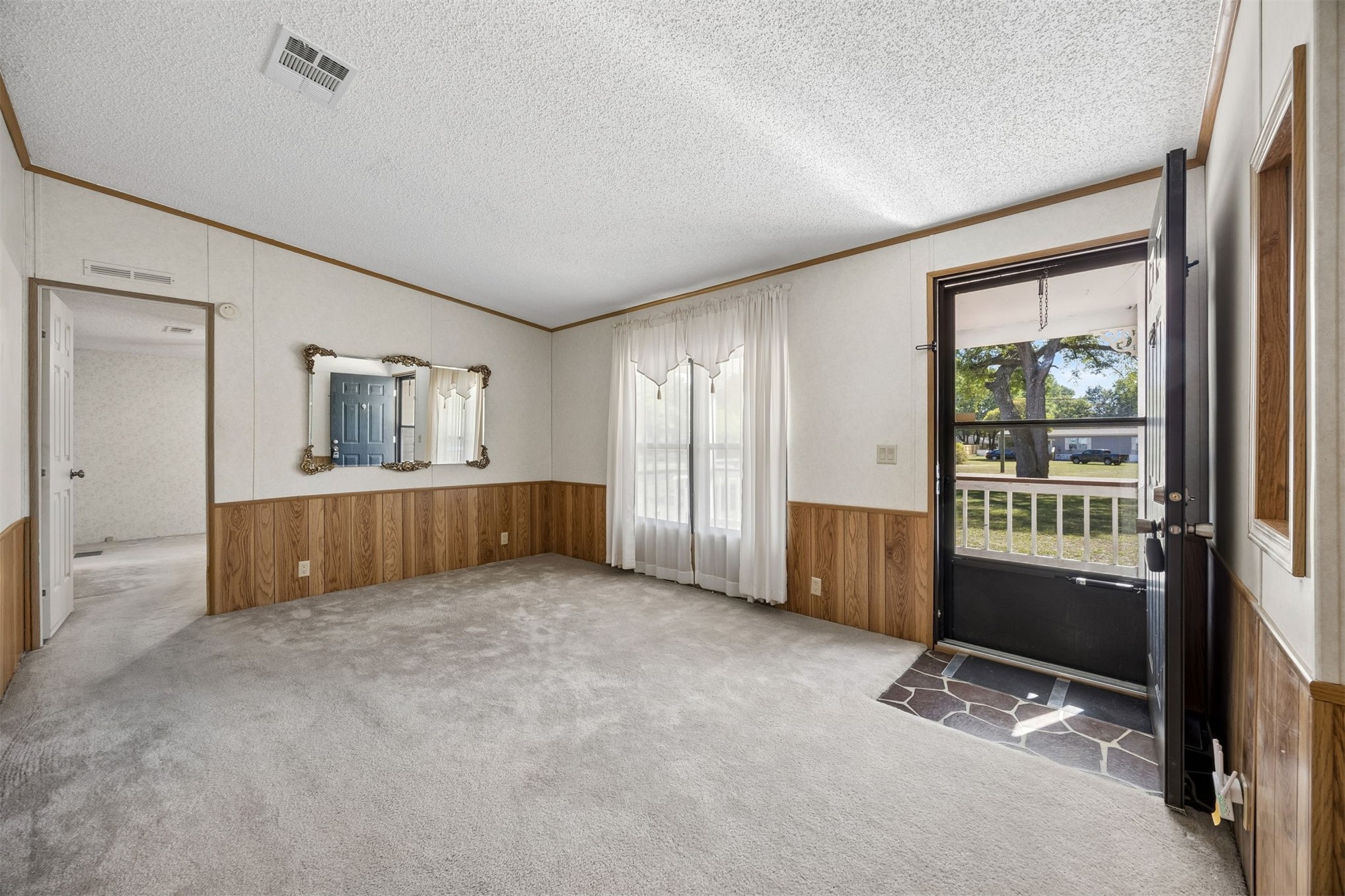85256 Stephen Road Yulee, FL 32097 - Photo 4 of 48 a view of an empty room with a window