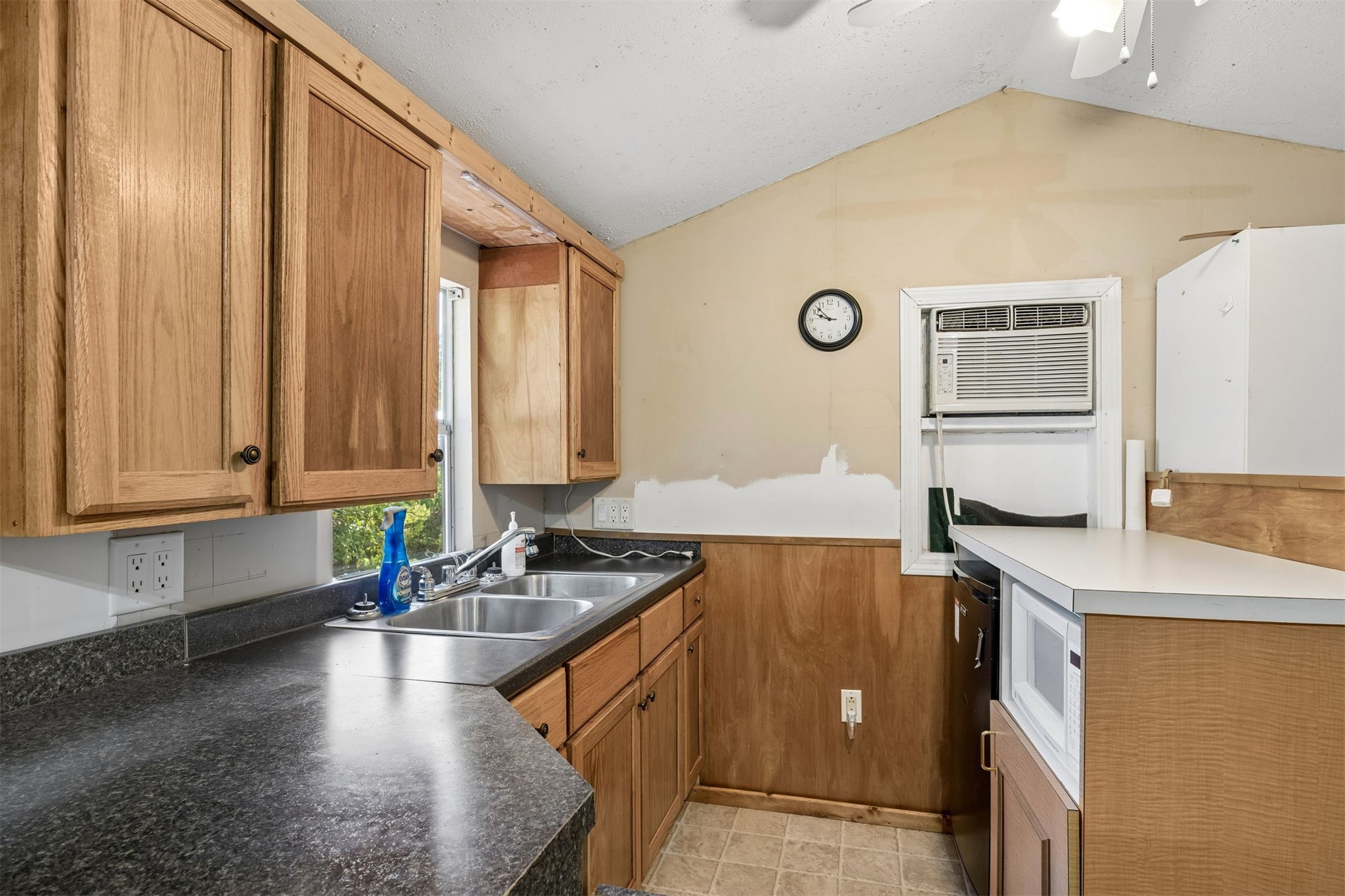 85256 Stephen Road Yulee, FL 32097 - Photo 41 of 48 a kitchen with a sink stove and cabinets