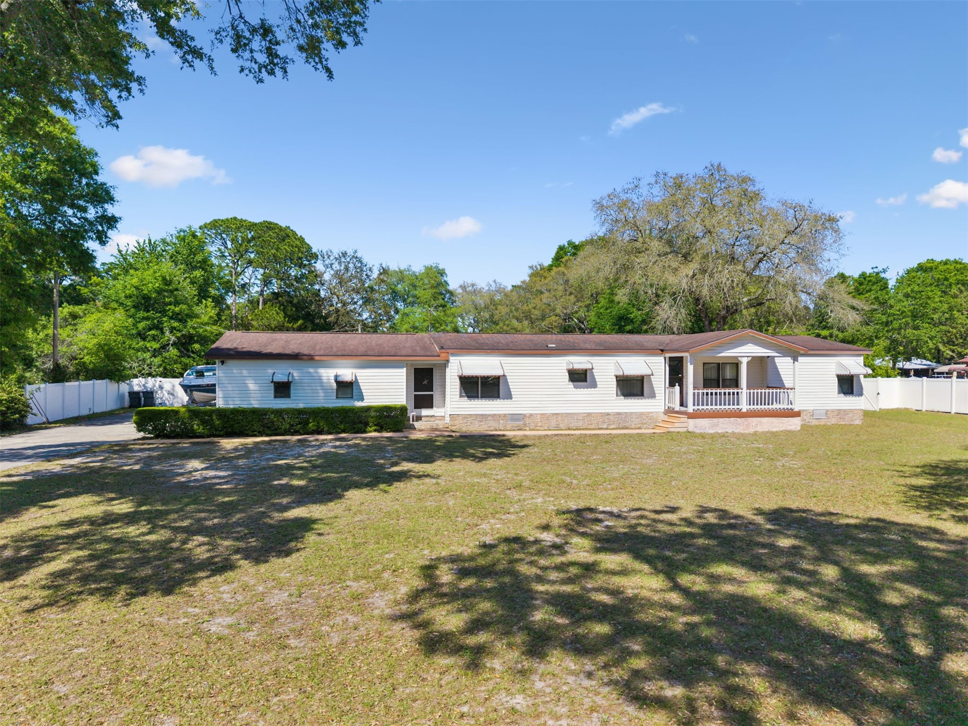 85256 Stephen Road Yulee, FL 32097 - Photo 46 of 48 a front view of a house with a garden