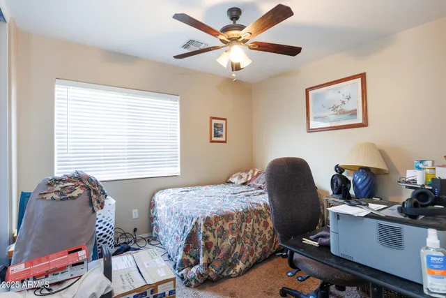 a blue chair sitting in front of a building