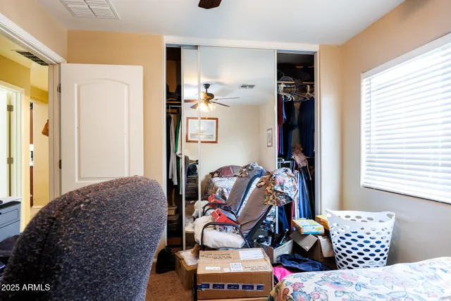 a view of a backyard with table and chairs potted plants