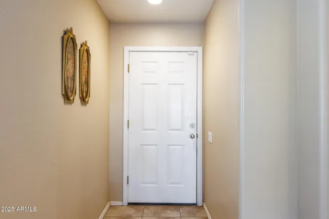 a kitchen with granite countertop a stove cabinets and refrigerator