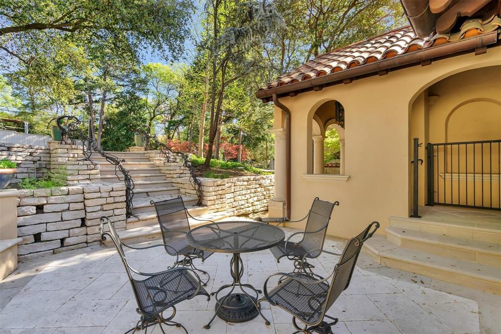 4612 Watauga Road Dallas, TX 75209 - Photo 32 of 32 a patio with table and chairs and potted plants