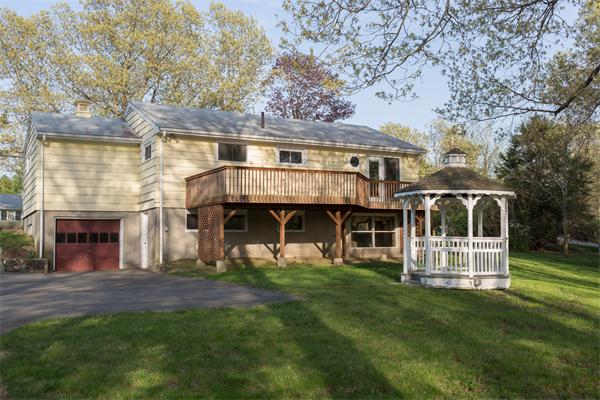 1347 Bay Road Sharon, MA 02067 - Photo 1 of 19 a front view of a house with a yard