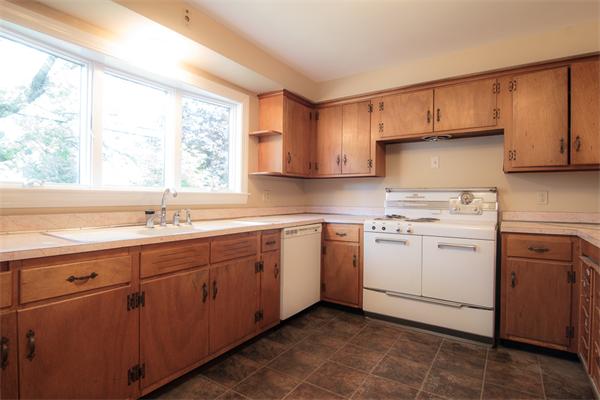 1347 Bay Road Sharon, MA 02067 - Photo 14 of 19 a kitchen with sink cabinets and window
