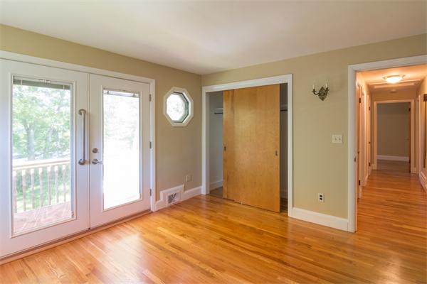 1347 Bay Road Sharon, MA 02067 - Photo 19 of 19 a view of an empty room with wooden floor and a window
