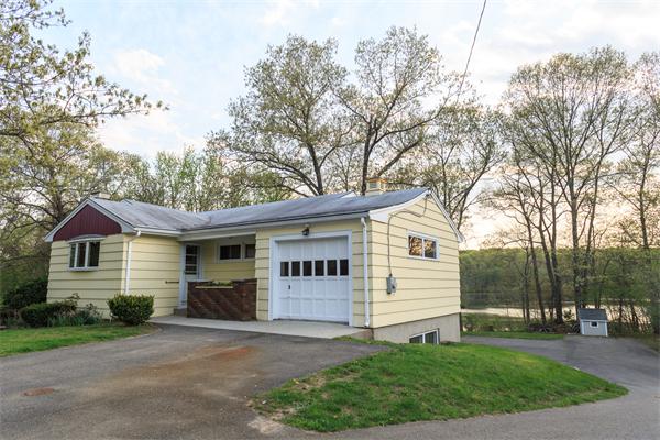 1347 Bay Road Sharon, MA 02067 - Photo 2 of 19 a front view of a house with a garden and trees