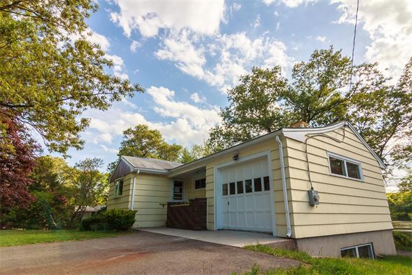 1347 Bay Road Sharon, MA 02067 - Photo 5 of 19 a view of a white house with a large tree