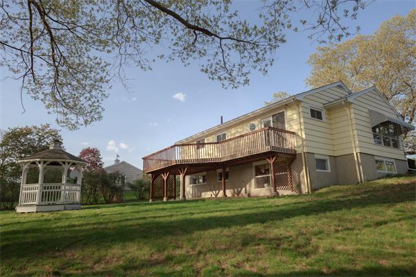 1347 Bay Road Sharon, MA 02067 - Photo 6 of 19 a front view of a house with a garden
