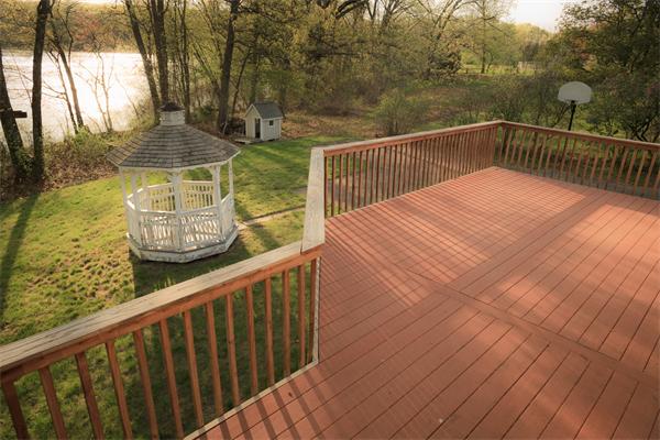 1347 Bay Road Sharon, MA 02067 - Photo 9 of 19 a view of balcony with wooden floor and fence