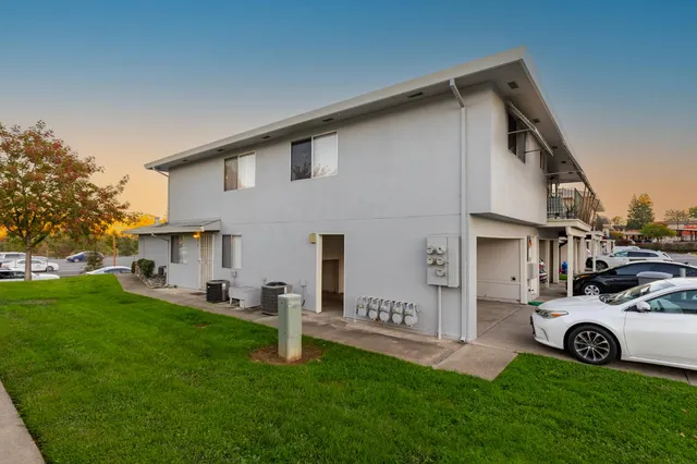 a view of a house with a back yard