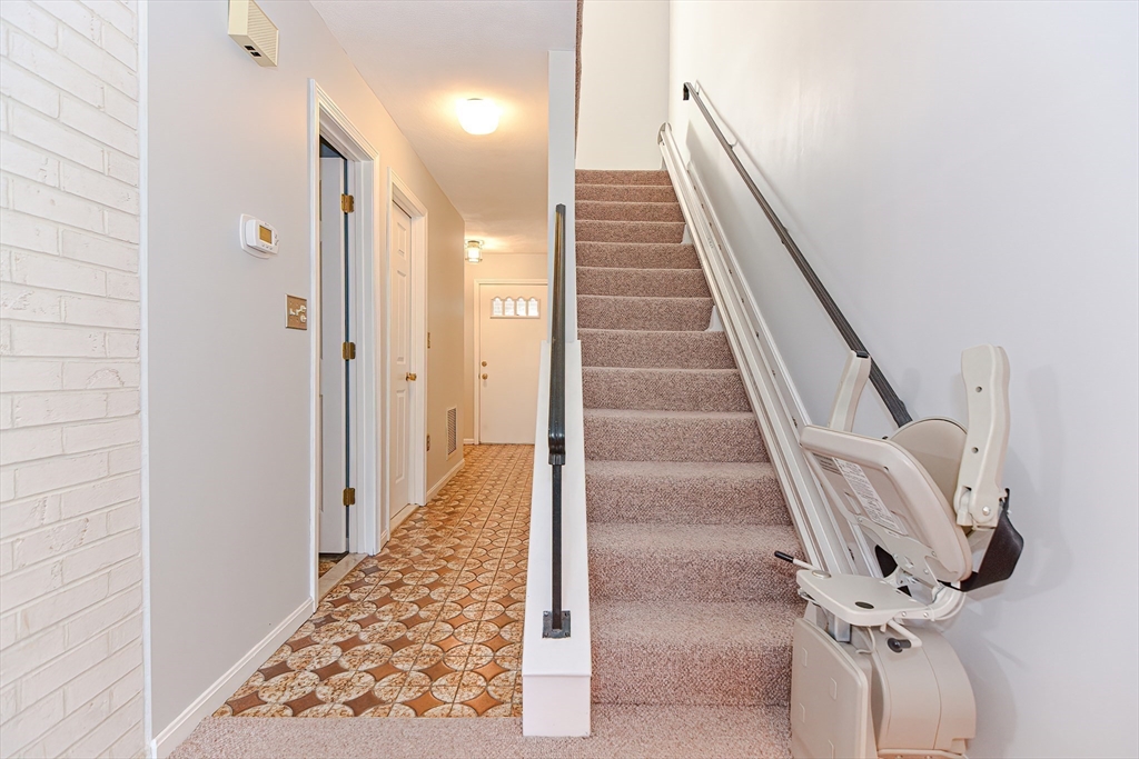 23 Tamarack Lane, Unit 23 Peabody, MA 01960 - Photo 20 of 42 a view of a hallway with wooden floor and entryway