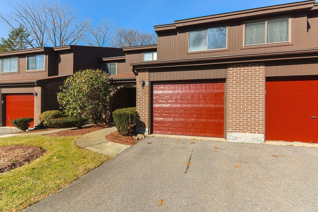 23 Tamarack Lane, Unit 23 Peabody, MA 01960 - Photo 2 of 42 a front view of a house with garden