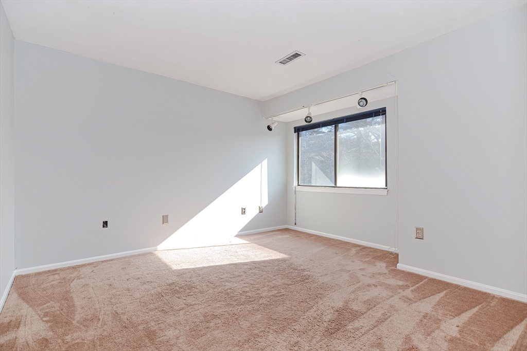 23 Tamarack Lane, Unit 23 Peabody, MA 01960 - Photo 24 of 42 a view of an empty room with a window