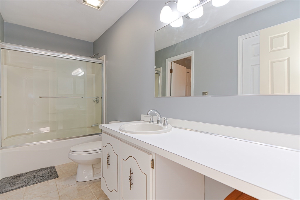 23 Tamarack Lane, Unit 23 Peabody, MA 01960 - Photo 27 of 42 a bathroom with a sink a toilet and shower