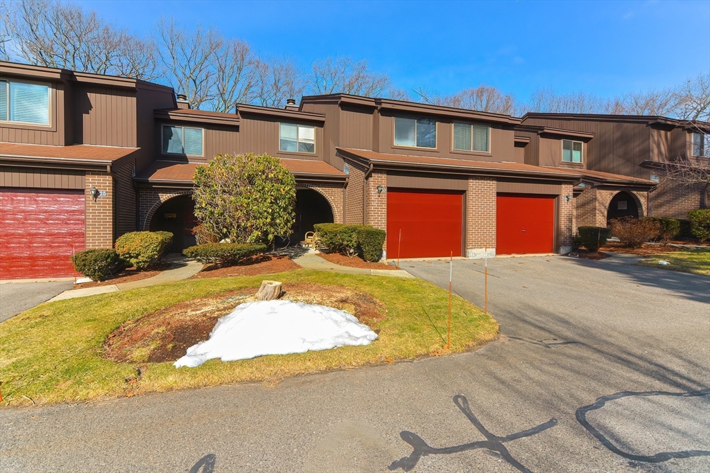 23 Tamarack Lane, Unit 23 Peabody, MA 01960 - Photo 34 of 42 a front view of a house with a yard