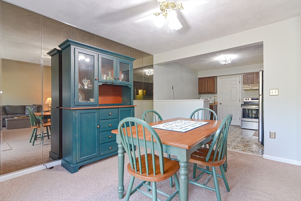 23 Tamarack Lane, Unit 23 Peabody, MA 01960 - Photo 10 of 42 a view of a dining room with furniture