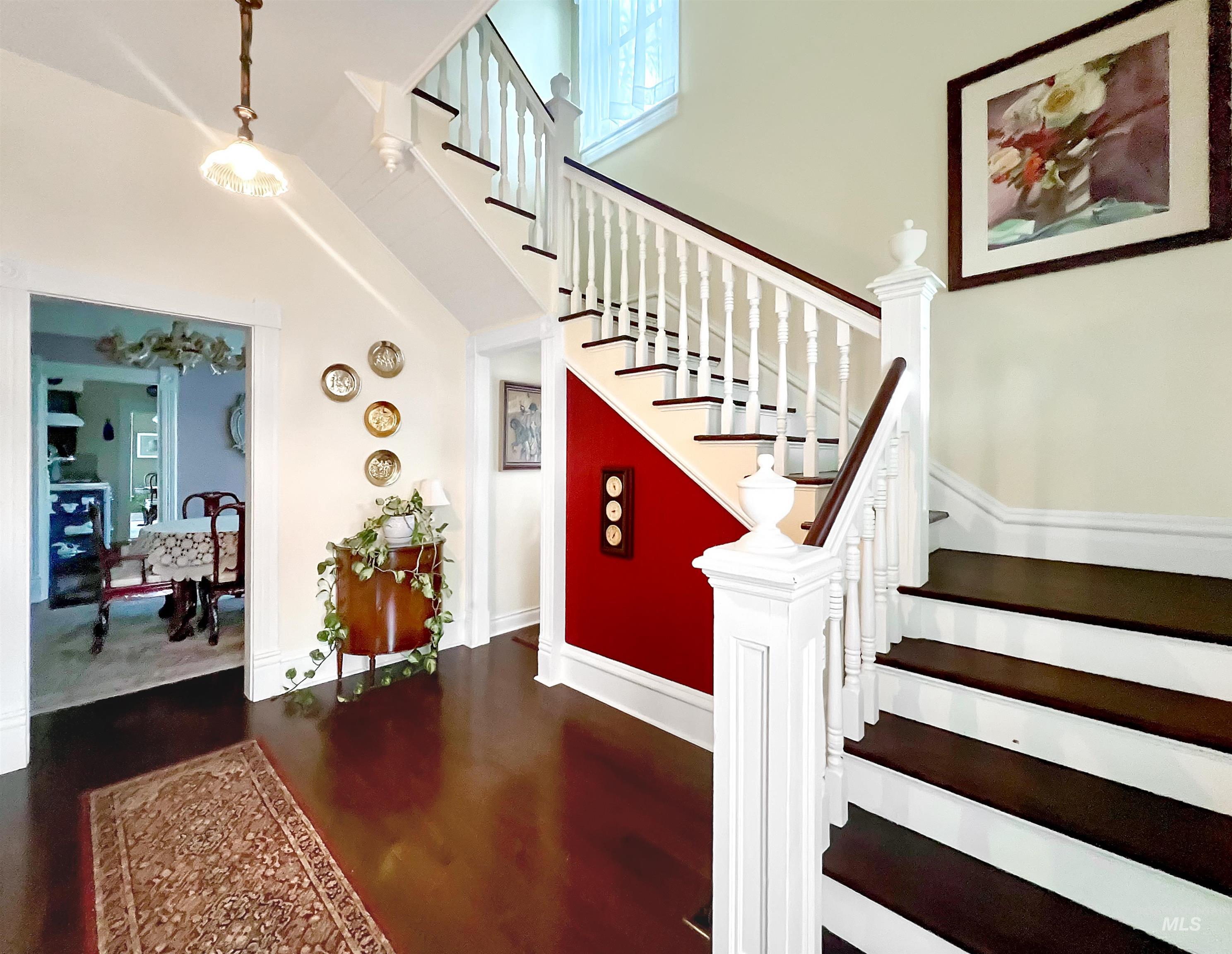 516 East Main Street Weiser, ID 83672 - Photo 12 of 50 Stairway featuring a high ceiling and wood finished floors