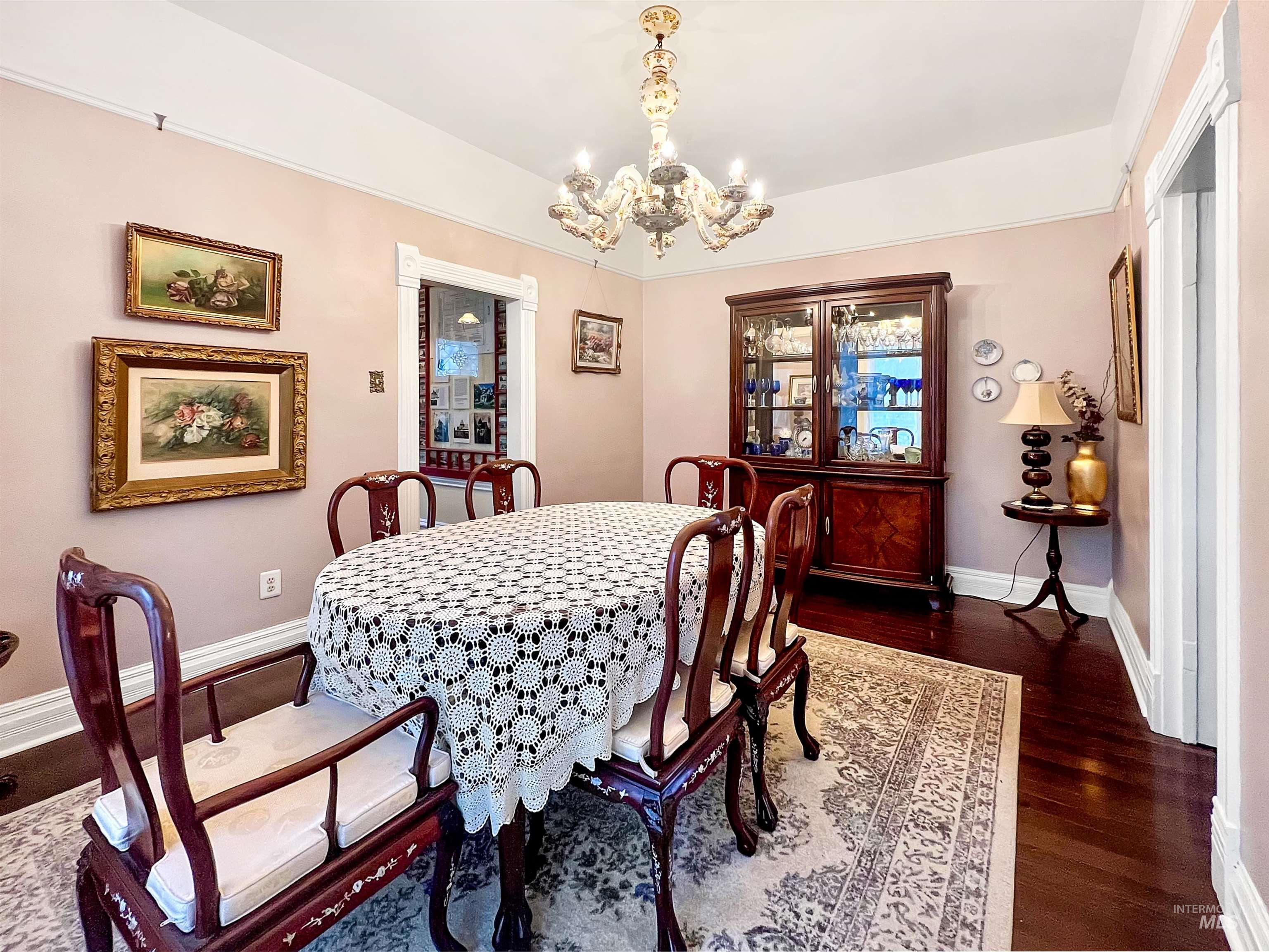 516 East Main Street Weiser, ID 83672 - Photo 25 of 50 Dining room with amazing antique chandelier and dark wood finished floors