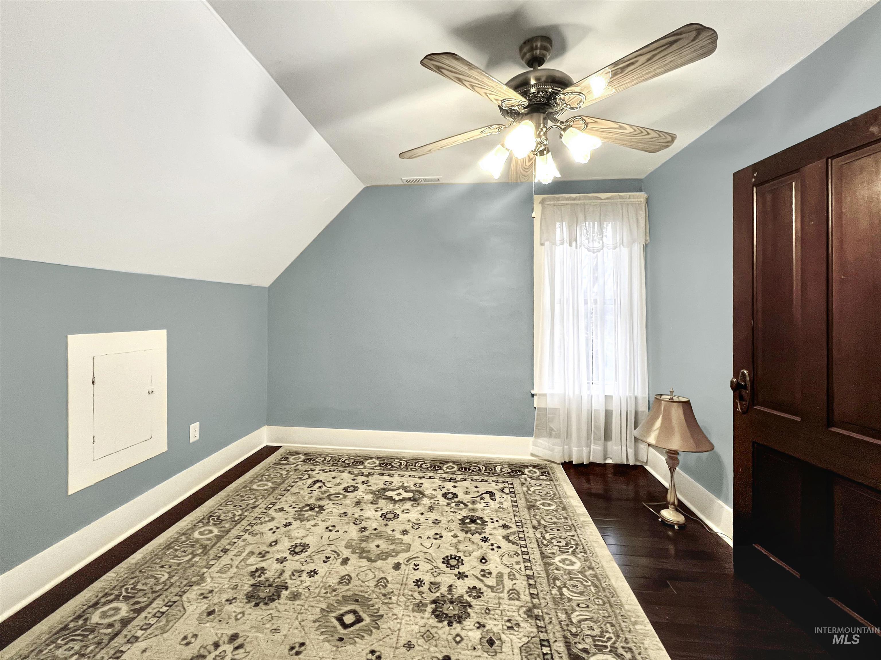 516 East Main Street Weiser, ID 83672 - Photo 35 of 50 Additional upstairs bedroom with a ceiling fan, vaulted ceiling, and dark wood finished floors
