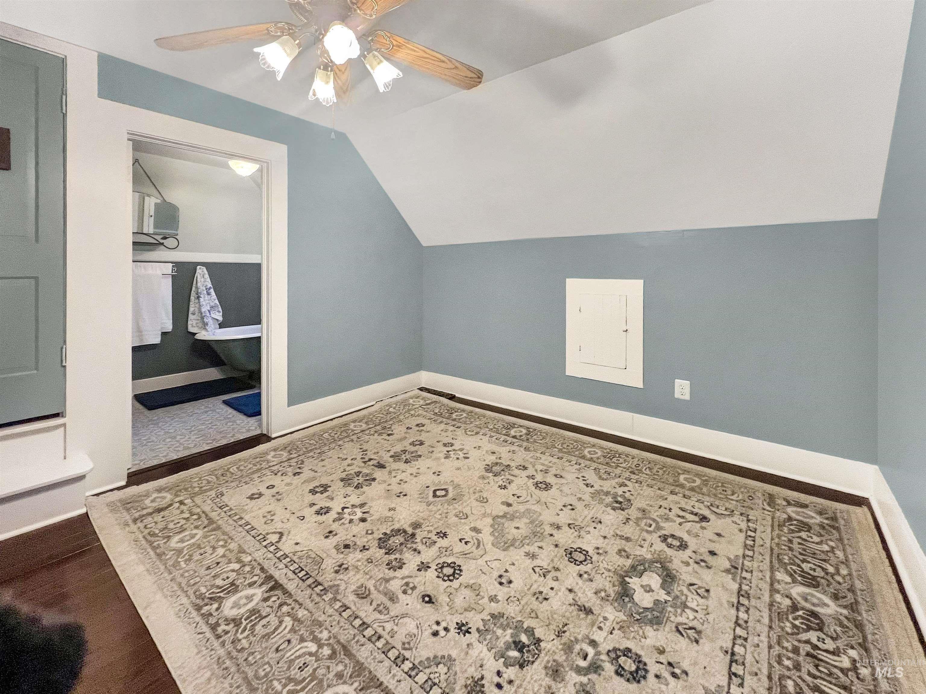 516 East Main Street Weiser, ID 83672 - Photo 36 of 50 Additional upstairs bedroom featuring ceiling fan, vaulted ceiling, and dark wood-style floors
