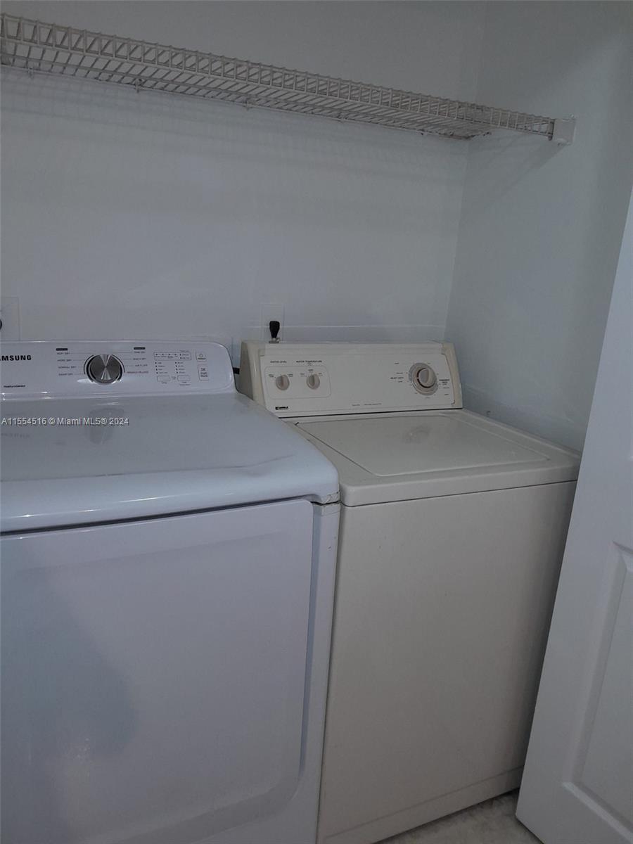 4241 West McNab Road, Unit 27 Pompano Beach, FL 33069 - Photo 16 of 29 a utility room with dryer and washer