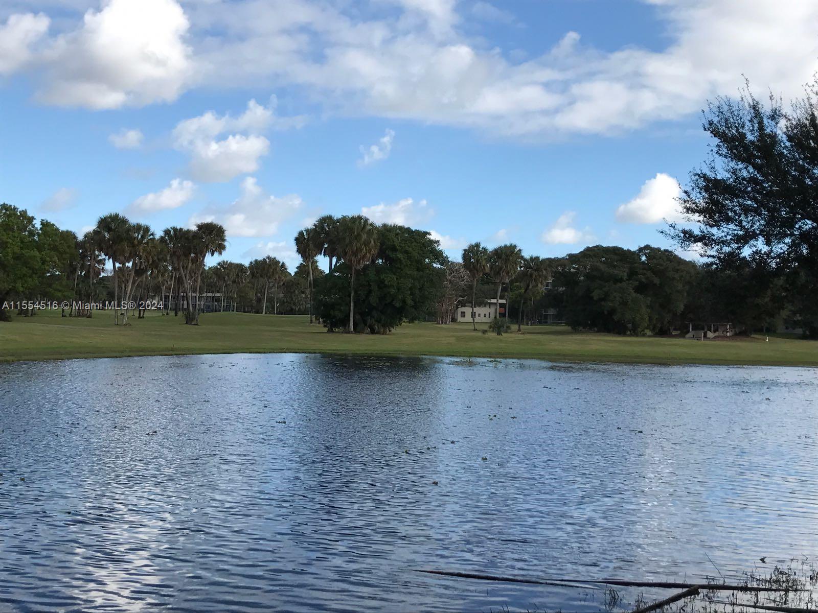 4241 West McNab Road, Unit 27 Pompano Beach, FL 33069 - Photo 27 of 29 a view of a lake