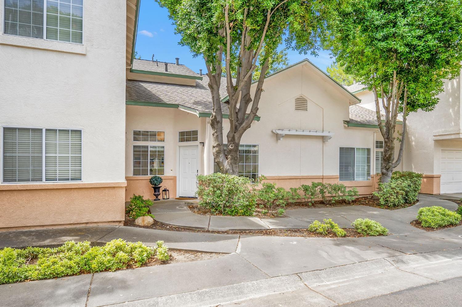 1162 Greene Terrace Davis, CA 95618 - Photo 1 of 1 a front view of a house with a yard and potted plants