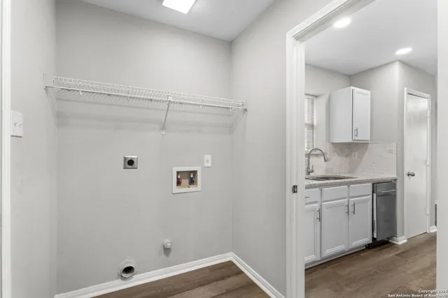 a bathroom with a shower sink and mirror