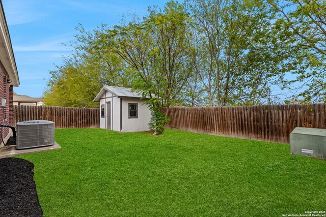 a view of a backyard with a garden