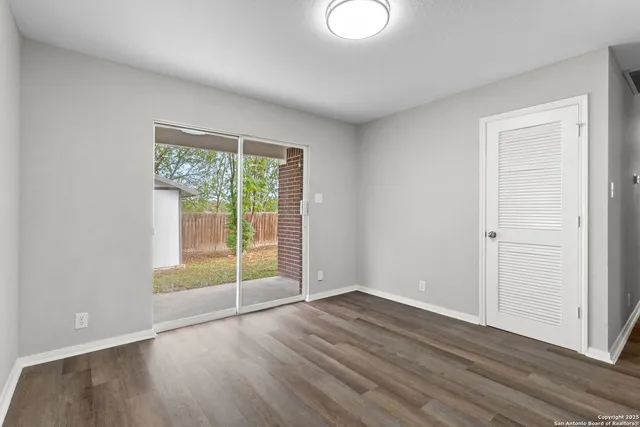a view of a livingroom with wooden floor