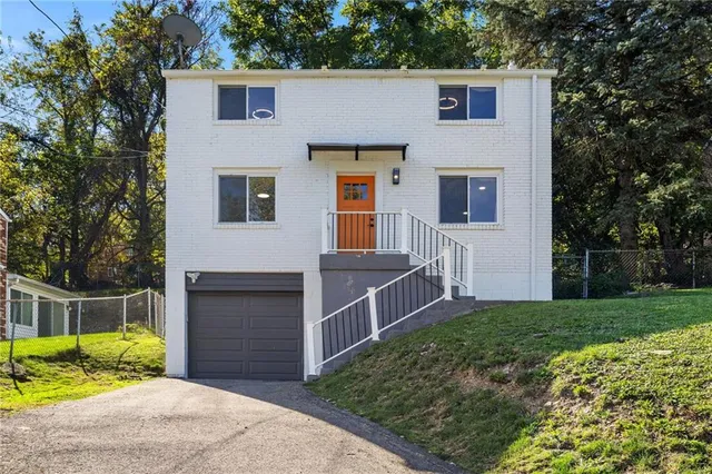 a view of backyard with deck and seating area