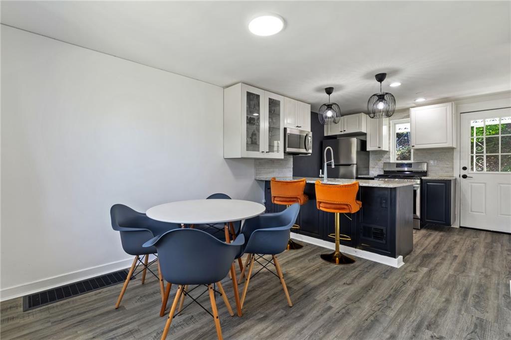8144 Lincoln Road Verona, PA 15147 - Photo 11 of 33 a living room with furniture and kitchen view